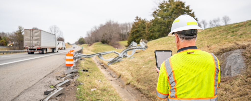 Pillar employee analyzing destroyed guard rail