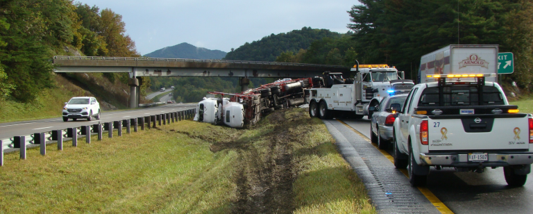 Truck wrecked on side of highway