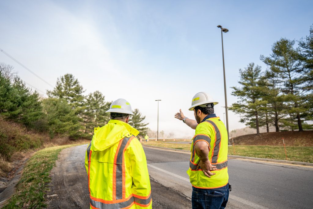 two men talking about roadwork