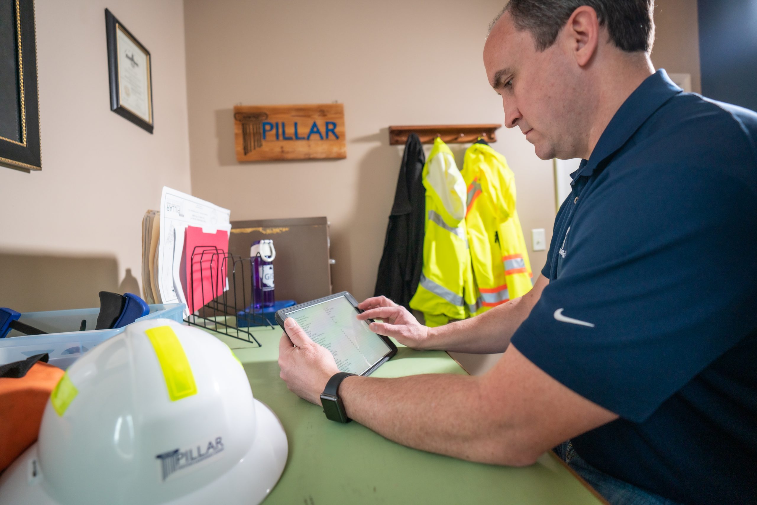 man reviewing data on a tablet