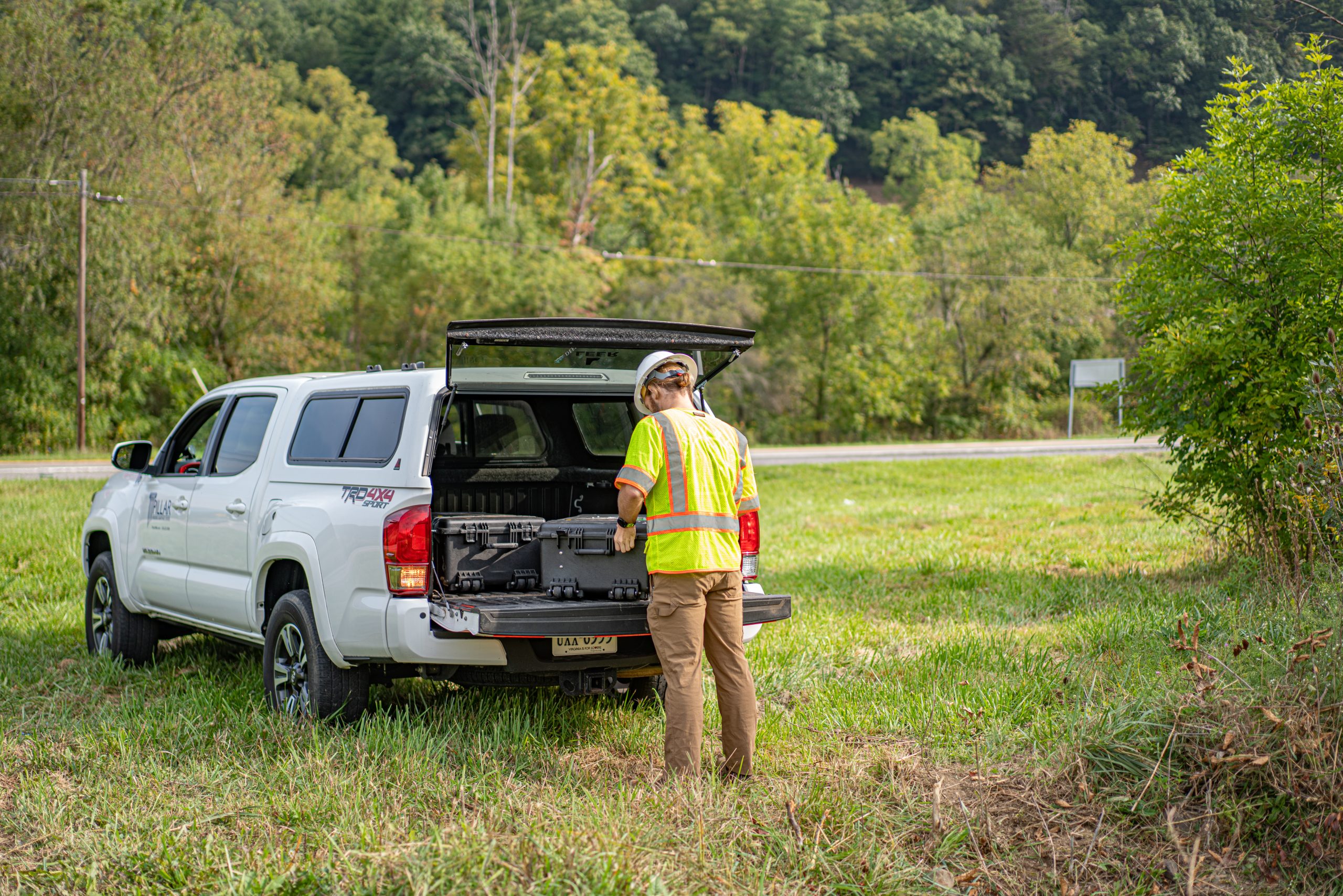 man packing up pipe crawler