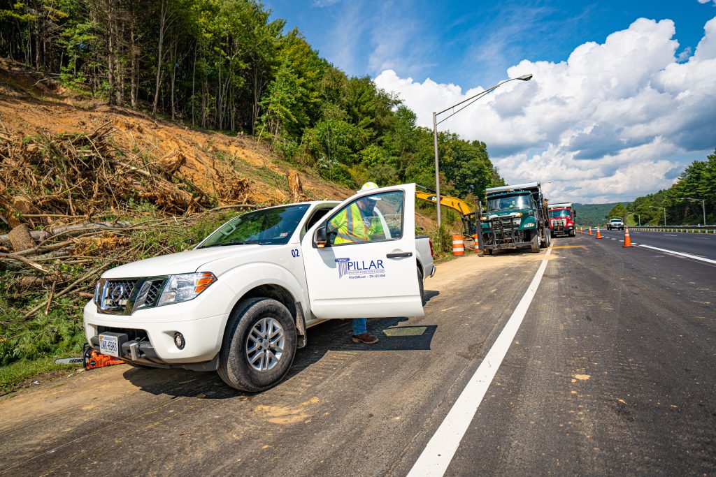 man getting out of a pillar truck