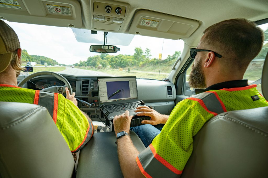 man on a laptop in a truck