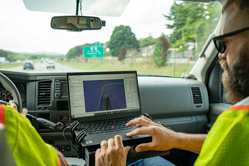 man viewing realtime data on laptop