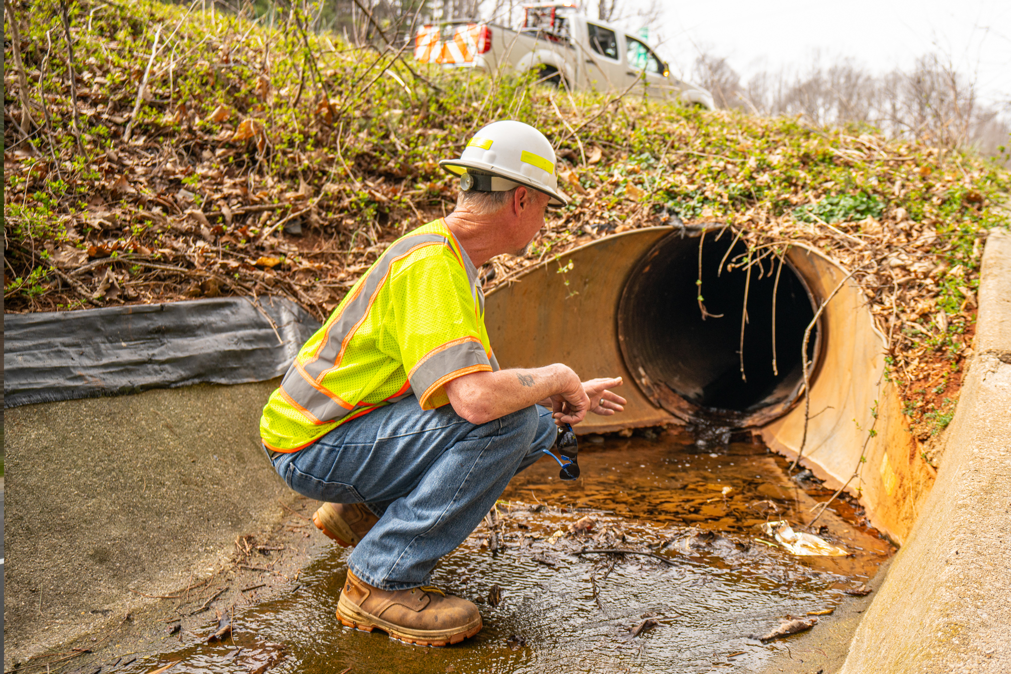 PILLAR Employee Assessing Underground Pipe