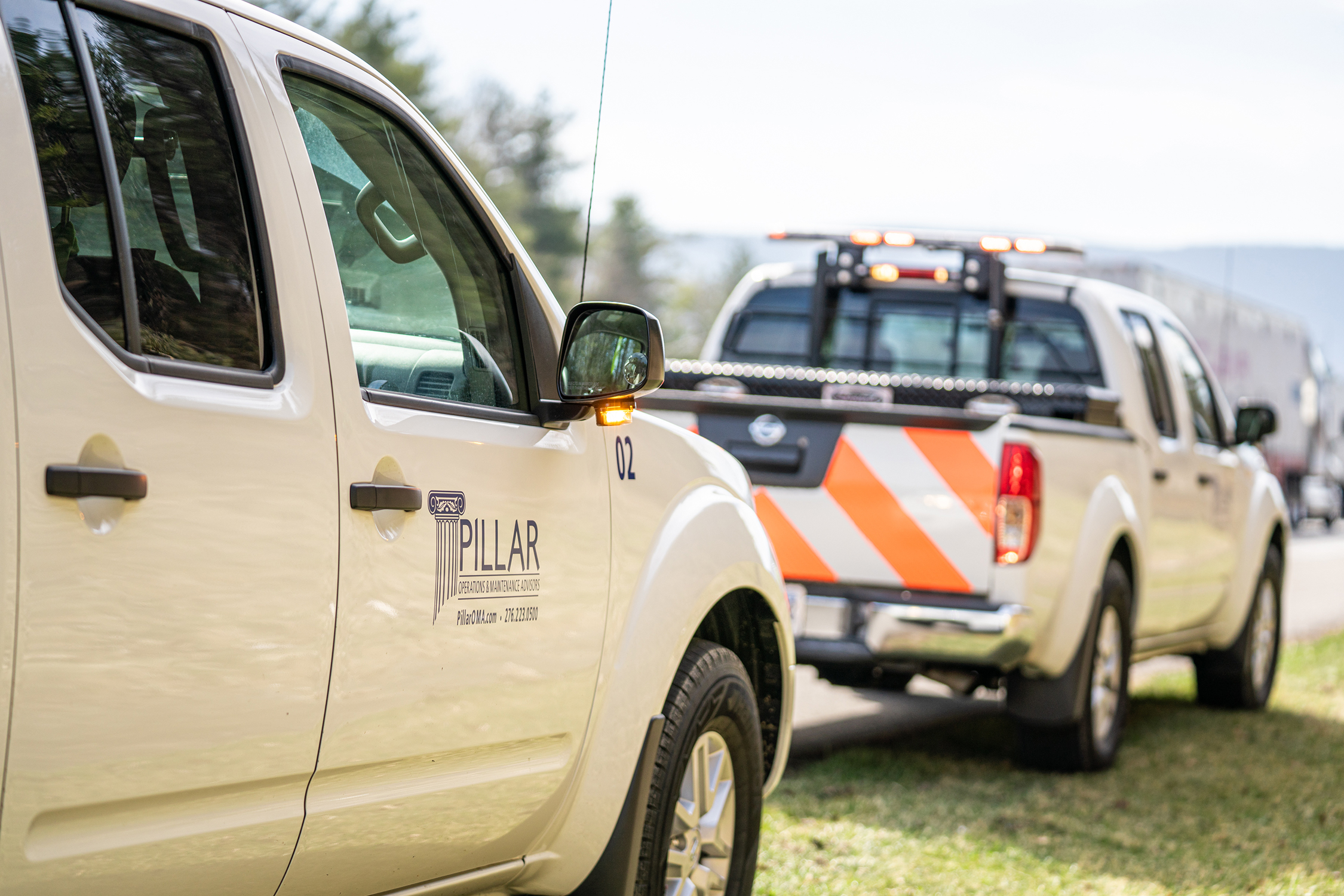PILLAR Trucks parked on the side of the road